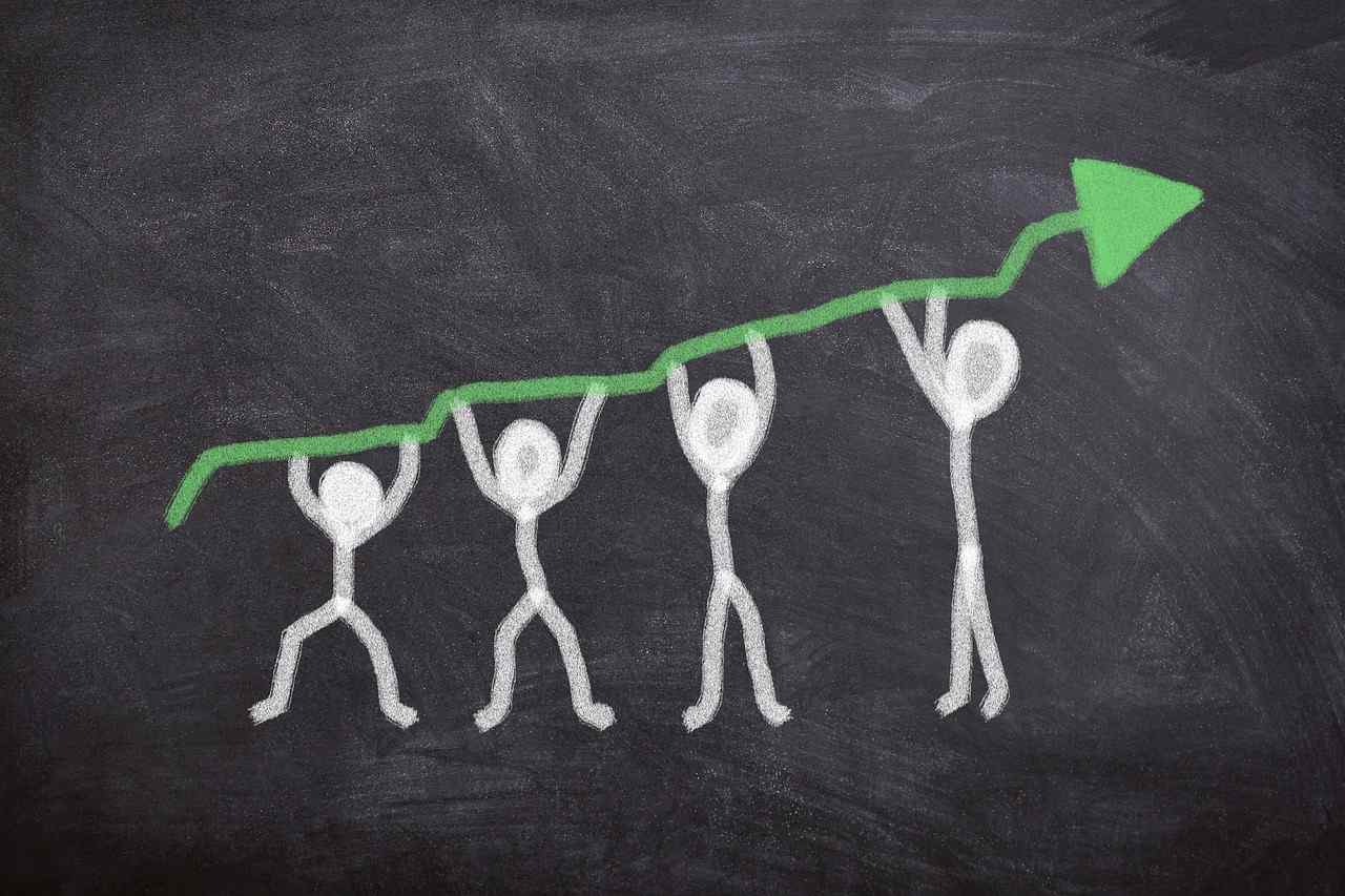 Illustration of four figures lifting a rising green arrow, symbolizing teamwork and upward business growth